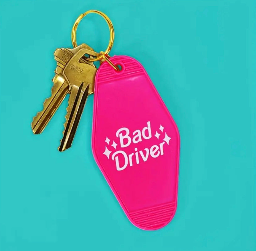 Bad Driver, Keychain, Humor, Quirky, Car accessories, Lighthearted, Funny, Novelty, Reminder, Road mishaps, Driver humor, Durable, Personalized, Unique, Conversation starter, Automobile, Gift idea, Everyday carry, Memorable, Style