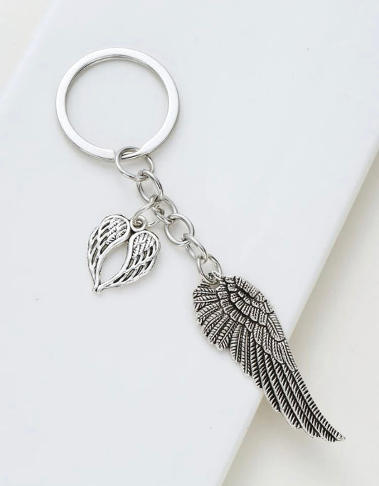  Angel, Wing, Keychain, Guardian, Protection, Elegance, Grace, Celestial, Symbolism, Heavenly, Charm, Accessory, Gift, Feathers, Serenity, Beauty, Reminder, Metal, Durable, Ornament